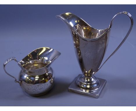 TWO SILVER CREAM JUGS, one square based, helmet shaped, 3 ozs, London 1809 and a small bowl shaped cream jug, 1.3 ozs, marks 