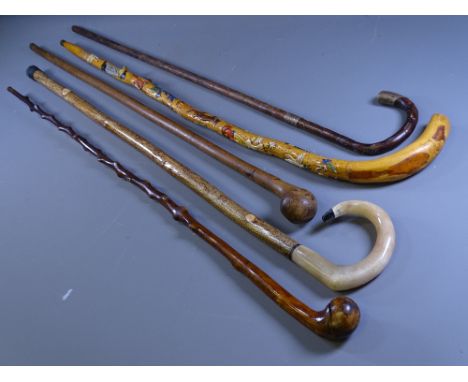 WALKING STICKS, three Old Country made sticks, one with silver band and tip, a modern Shepherd's type stick and a novelty Alp