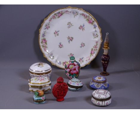 PATCH BOXES, a small parcel, a cinnabar perfume bottle and an oriental china perfume bottle all on a circular floral dish