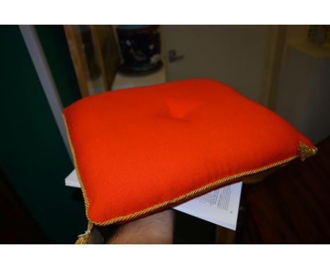 Red cushion from a chair used at the Investiture of Prince Charles at Caernarfon Castle