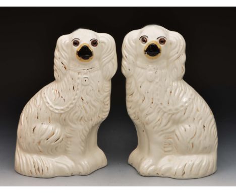 Pair of Staffordshire Pottery model spaniels 27cm high
