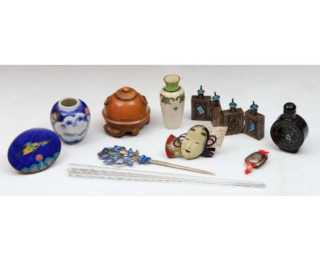 Japanese Karumbu carved nut in the form of a miniature lidded pot resting on the back of a stoat, signed, other pieces to inc