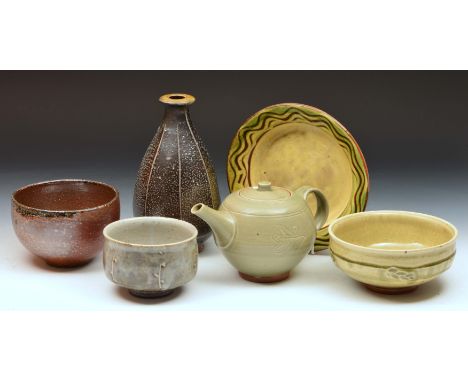 Studio Pottery, a tea pot and bowl by Leach Pottery, a dish by Clive Bowen, two footed bowls and faceted bottle by Mark Griff