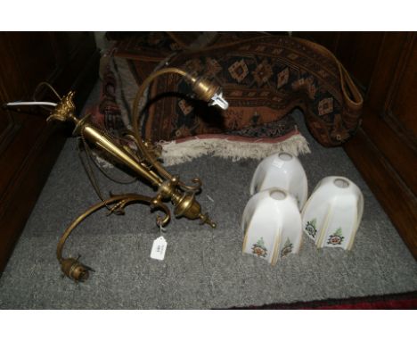 Gilt metal three branch chandelier with central torch-like column with three milk glass shades, 42cm high