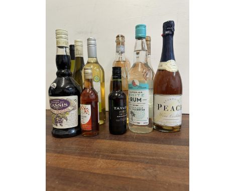 Twelves mixed bottles to include Sparkling Peach wine cocktail, Port, White Rum, CassisLocation:If there is no condition repo