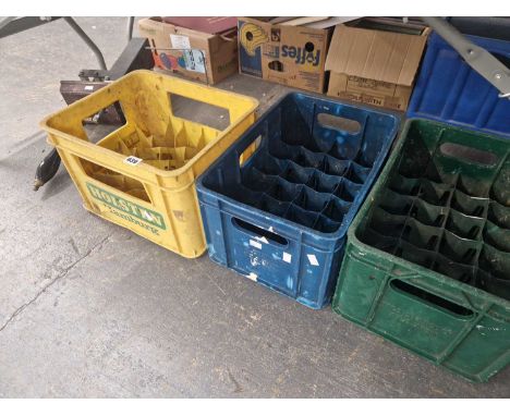 Three vintage beer crates and a beer engine.
