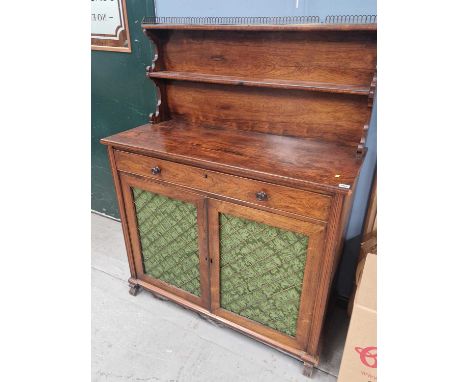 An early 19th century rosewood chiffonier side cabinet with raised galleried shelf over a single frieze drawer and brass latt