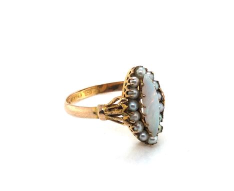 An antique opal and seed pearl navette-shaped cluster ring. Dated 1902, ring size O. Weight 1.91 grams. 