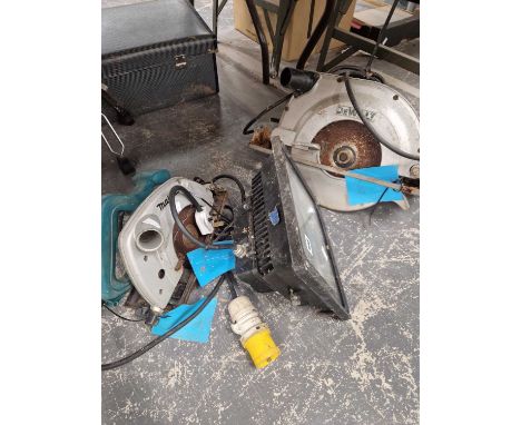 Two chop saws and a spot light. 