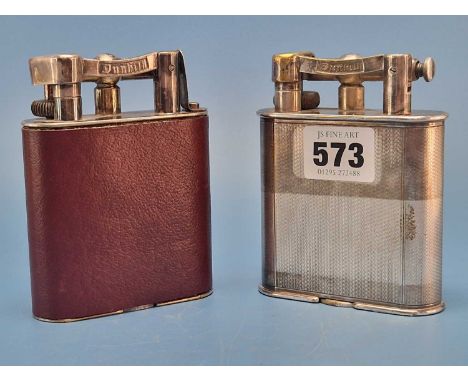 Two Dunhill 'Giant' table lighters, one with an engine turned electroplate body and the other leather mounted
