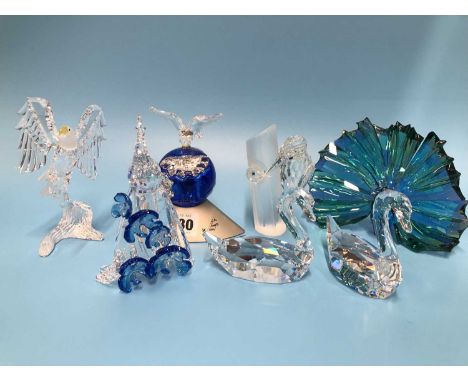 A Swarovski dove of peace on a blue globe designed by Anton Hirzinger in 2000. H 12cms. two Swarovski swans, an eagle, two pe