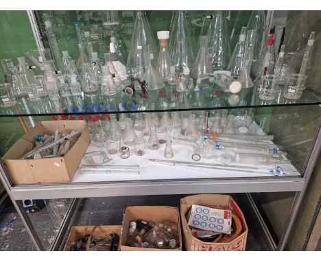 A large selection of vintage scientific glass wares.