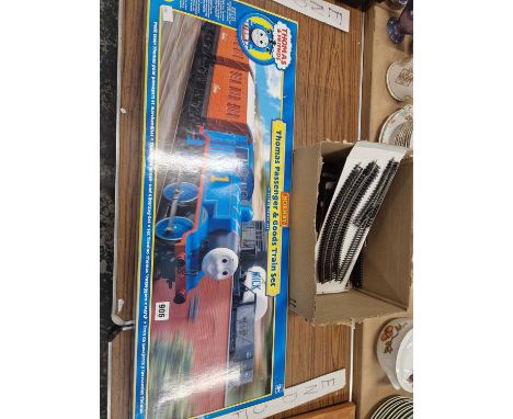 A hornby OO gauge thomas the tank engine boxed set and a small selection of railway track.