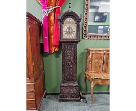 A late 18th century 8 day longcase clock by Joseph Smallwood of Sandbach in a carved oak case. H 220cms