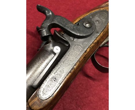 A fine 19th-century Thomas Boss and Co. percussion double rifle. 27 1/2 inch 14 bore Damascus barrels with broad sighted rib 