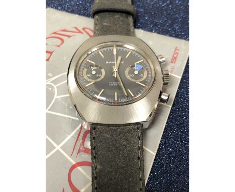 A Henri Sandoz wristwatch. Circa 1974. The chronograph dial grey dial in stainless steel case. Diameter 36 42 mm. The manual 