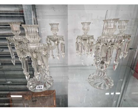 A pair of clear glass three light lustre candelabra