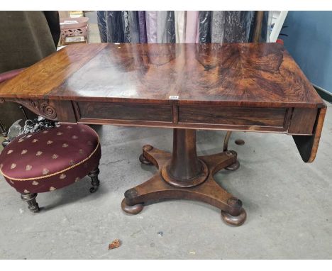 An early 19th century rosewood sofa table on cetral column support and platform base. 142 x 68 x 73 cm high (extended)