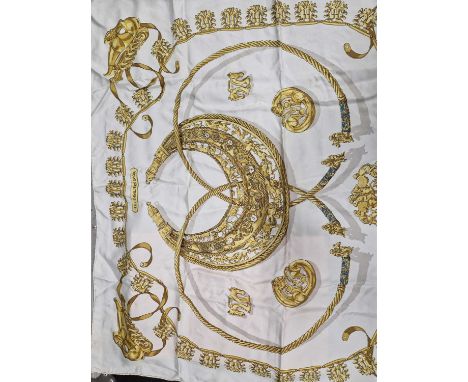 A Hermes silk scarf. in Hermes bag.