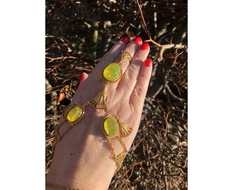Christain Dior. A Christian Dior by John Galliano scarab beetle hand chain with attached ring. Three amber glass scarab beetl