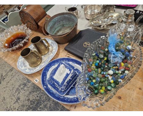 A very large cut glass bowl containing antique and later marbles, an art deco mantle clock, a brass jam pan, art glass bowl, 