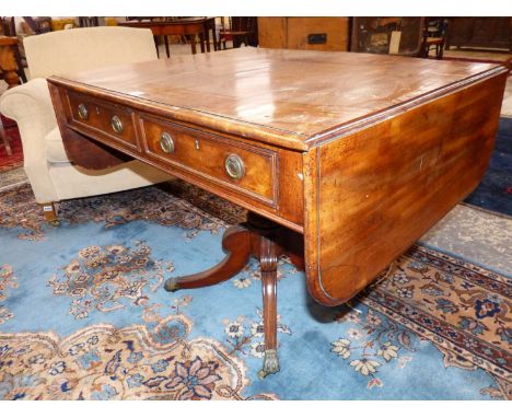 A late Georgian mahogany pedestal base sofa table. 