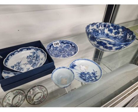 A Nanking Cargo blue and white tea bowl and saucer, two other Chinese blue and white saucers and an Arita blue and white bowl