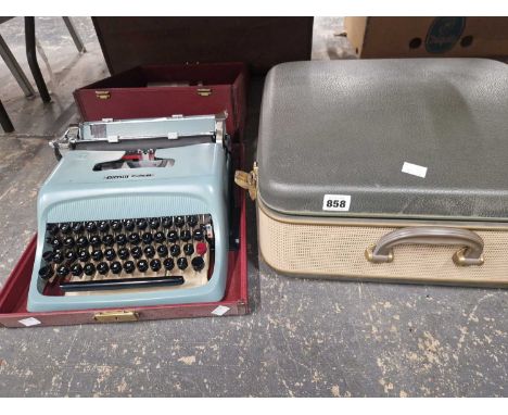 A Vintage typewriter and a reel to reel tape player