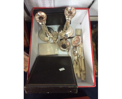 A collection of assorted silver and plated items, including a pair of Sterling silver candlesticks, hallmarked for Birmingham