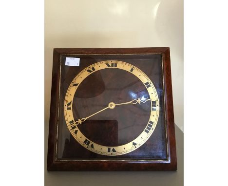 A contemporary square framed mantle clock, having a French escapement, Roman numerals to square dial, 23cm square