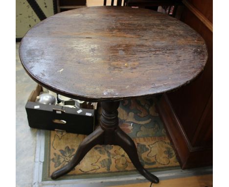 A George III tilt top tripod table