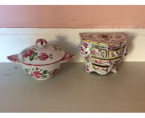 A ceramic miniature commode, possibly Marseille, circa 1760?, together with a small hand painted two handled dish and cover, 