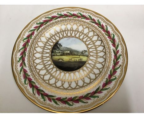 A late 20th century cabinet plate depicting Chatsworth House (27cm diam approx.) and a Royal Worcester cake stand in Vine Har