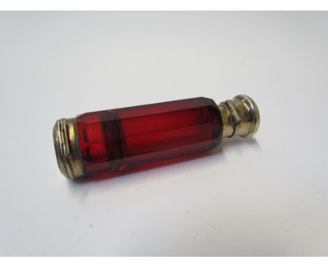 A Victorian ruby glass double ended perfume and smelling salts bottle, dent to lid, 10cm long