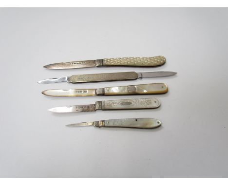 Three mother-of-pearl handled pen and fruit knives with silver blades, a similar example and a silver pen knife with engine t