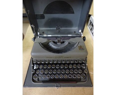 Aldis boxed vintage projector along with a Vintage typewriter in case