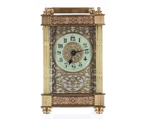 Carriage clock timepiece, the 1.75" cream chapter ring within a foliate pierced mask and ornate pillared brass case, 6.25" hi