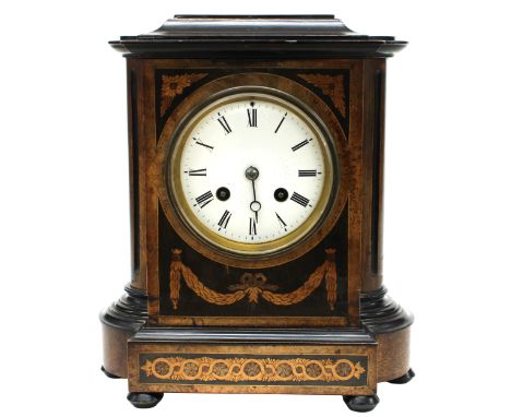 Attractive French walnut and ebonised two train mantel clock, the Japy Freres movement striking on a bell attached to the ins