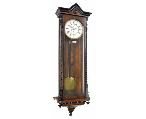 Walnut single weight Vienna regulator wall clock, the 7" white dial with subsidiary seconds dial, within a glazed case with e