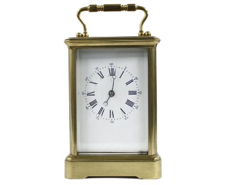 Carriage clock striking on a gong, within a corniche brass case, 7" high 