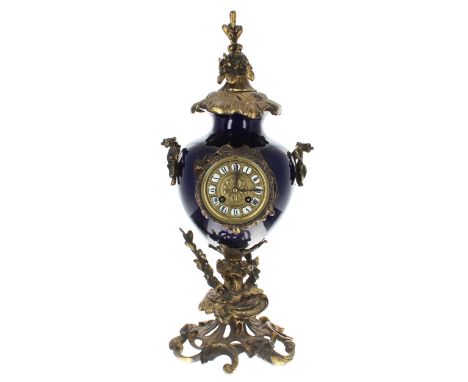 French gilt metal and cobalt blue pottery two train vase clock striking on a bell, the 3.25" gilt metal dial with Roman carto