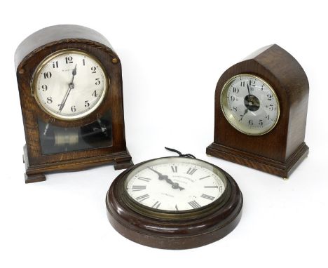 Bulle-Clock electric mantel clock within a rounded arched oak case, 12" high; also another Bulle Patent electric mantel clock