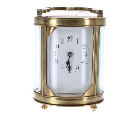 French carriage clock timepiece, within an oval brass case, 6.25" high (key) 