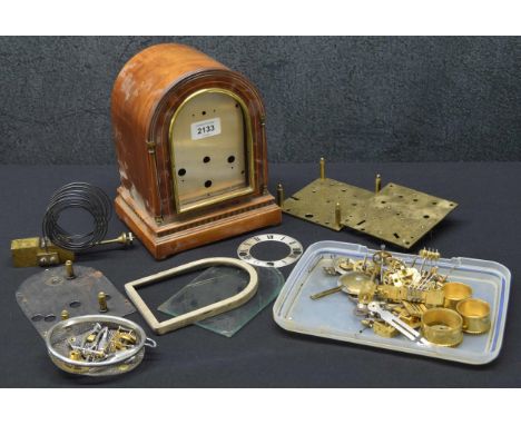 Small walnut three train mantel clock chiming on gongs and the movement in need of rebuilding, with 4" rounded arched dial wi