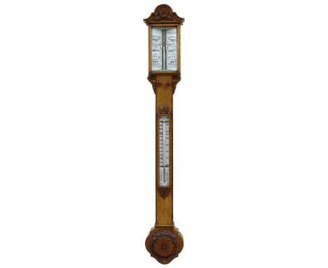 Good oak stick barometer/thermometer, the angled scale within a glazed window over a flat trunk fitted with a thermometer ove