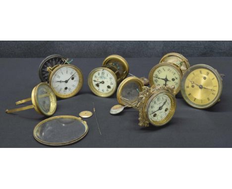 Five various French two train mantel clock movements with pendulums;&nbsp;also two longcase clock movements (7) 