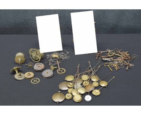 21 various mantel clock pendulums & 30 various winding keys; also two old 30 hour longcase clock movements**(Longcase clock m