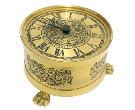 Reproduction Sinclair Harding gilt metal engraved table clock, fitted with an alarm mechanism and bell supported upon three c