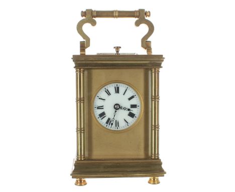 Small repeater carriage clock striking on a gong, stamped France to the base, the white enamel dial within a gilt mask and ba