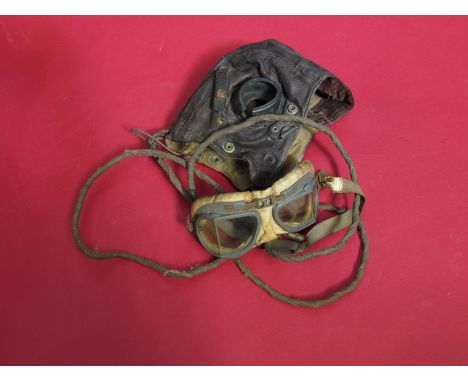A mid 20th Century British leather flying helmet and a pair of goggles 